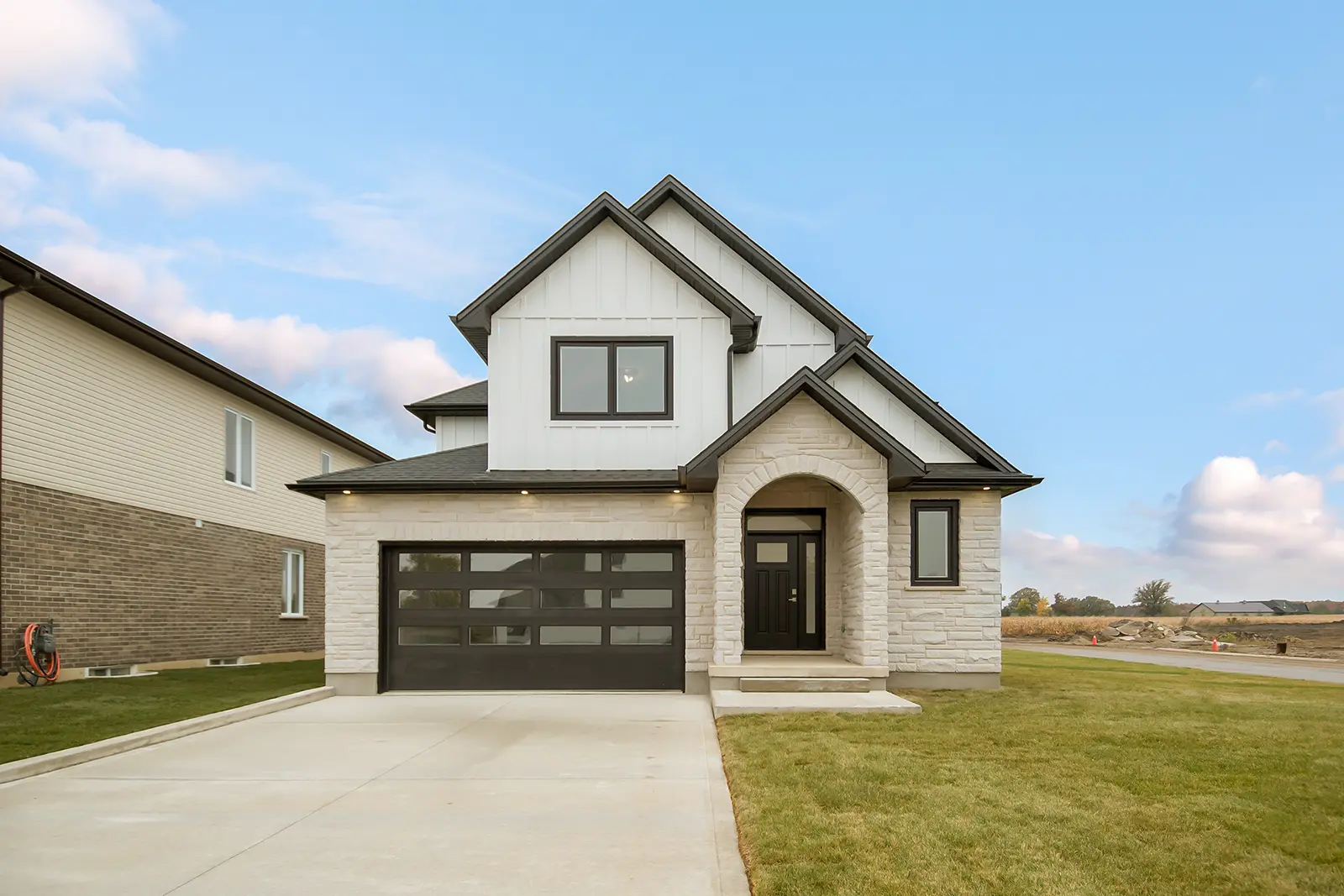 Modern home exterior featuring new siding, windows, and doors completed by MD Construction