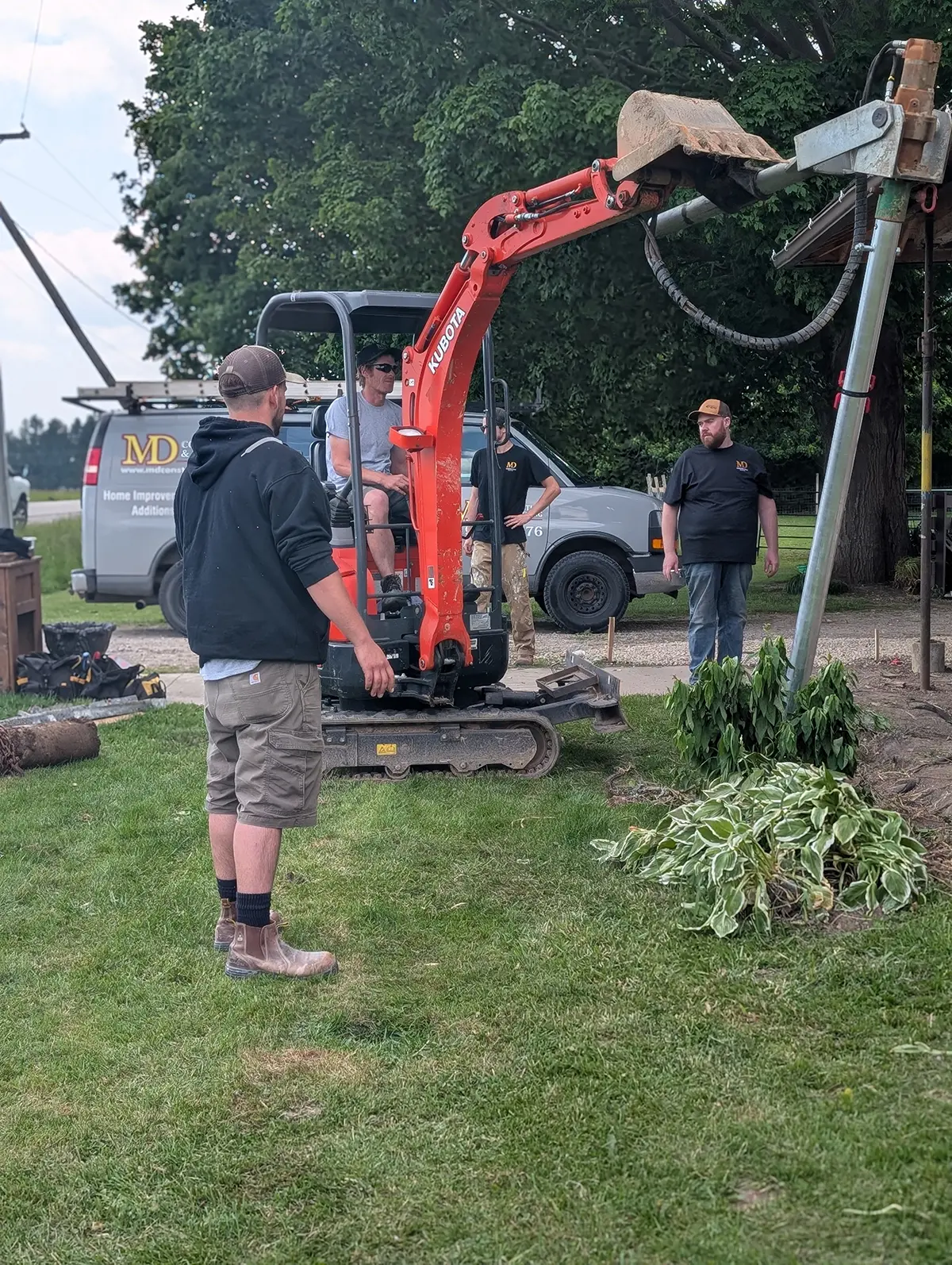 MD Construction team working on a residential construction site.
