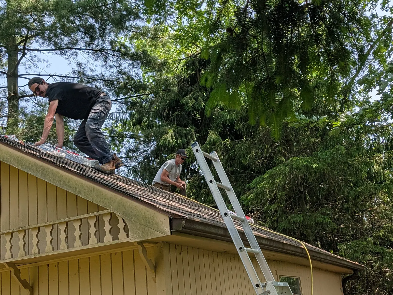 MD Construction crew performing home repairs on a roof, providing dependable craftsmanship and maintenance services.